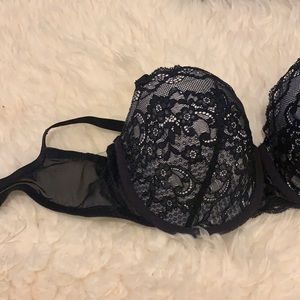 Brand new without tags. White and black lace bra 32DD
